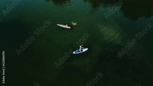 Surfboarding in the Amazon, an extreme sport, a water sport on a board.