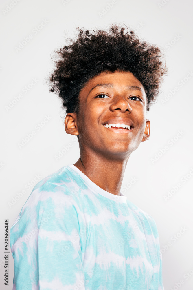 Cheerful black kid looking at camera Cheerful black kid looking at camera