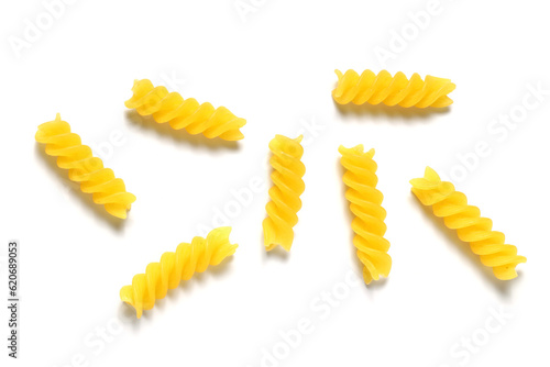Uncooked close up yellow fusilli pasta background. Spiral raw italian pasta. rotini