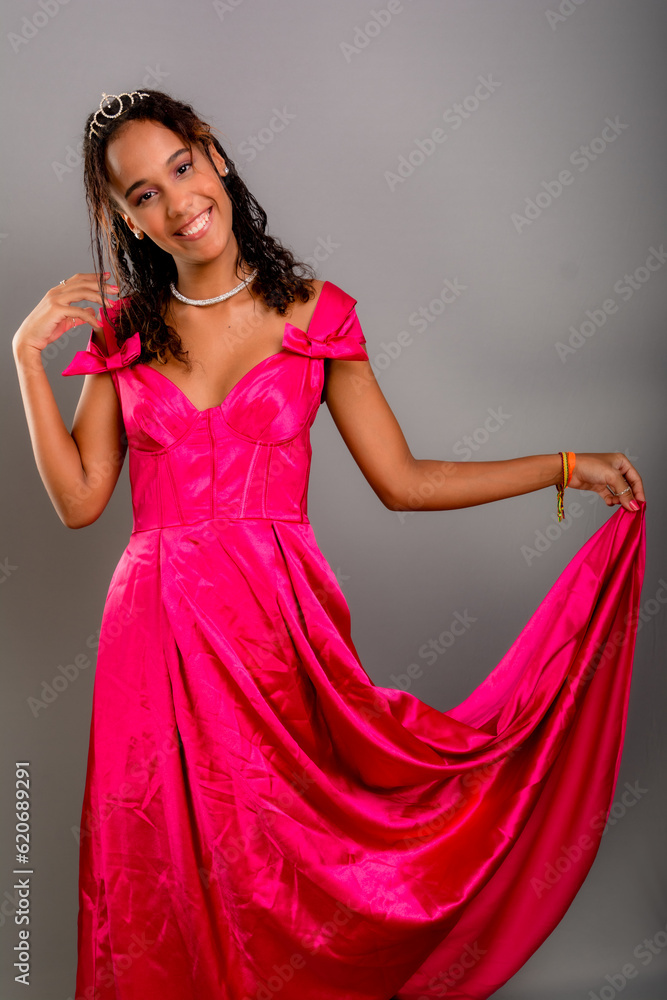 Teenage girl, beautiful, standing holding dress with hands. Teenage girl, beautiful, standing holding dress with hands.
