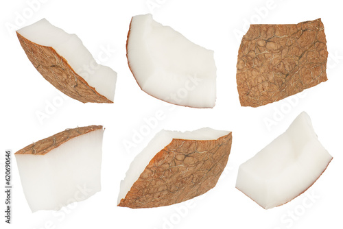 Slices of coconuts on a white isolated background. Different sides of coconut slices with a crust close-up. Coconut slices isolate.