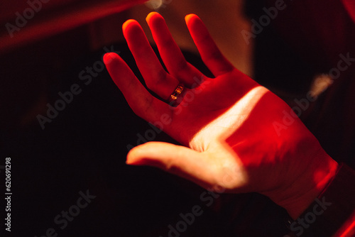Hand under sunlight and redlight. photo