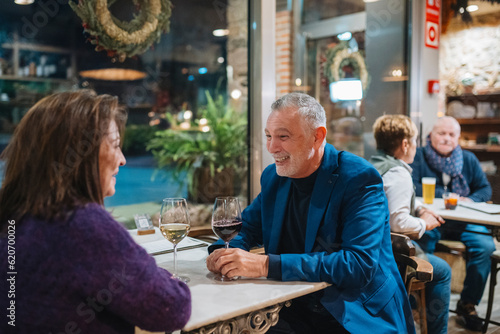 Mature couple having date in cafe photo