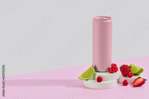 pink drink can on props with berries and lime.