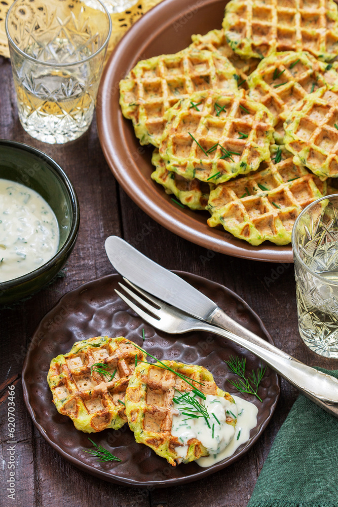 Zucchini wafers with dill and onion, served with sour cream sauce and wine.