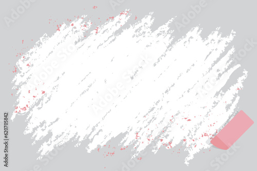 An erased area with copy space, eraser, and pink flakes
