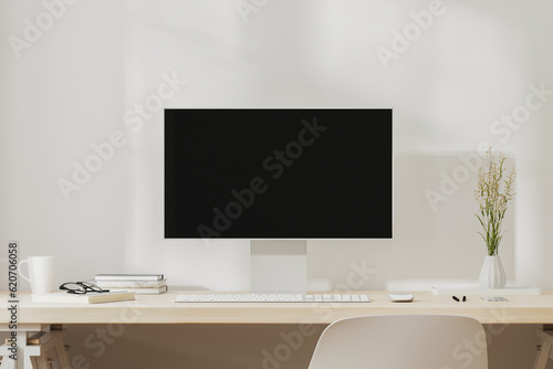 Workplace desk with computer screen, coffee mug and books, 3d render
