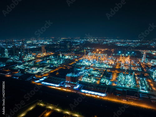 Aerial view oil and gas tank with oil refinery background 
