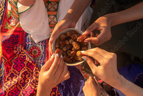 Friends Breaking Fast Together with Dates