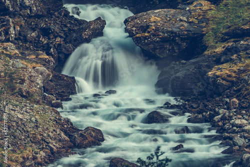 Scenic Waterfall in Rocky Norwegian Mountains