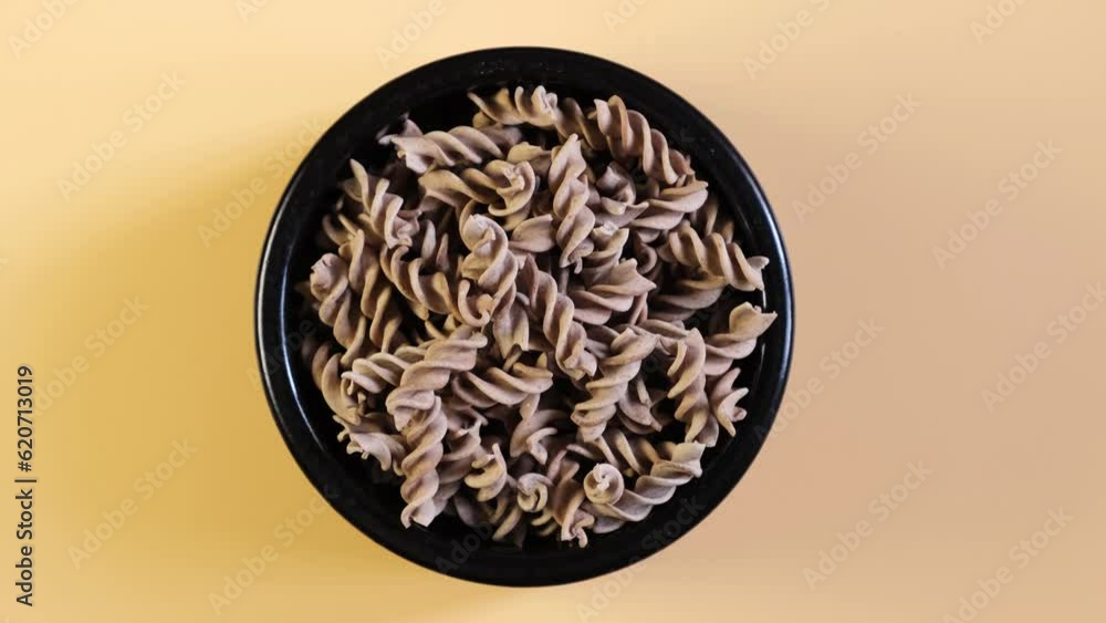 Pasta di Lino in bowl, top view. Flaxseed gluten free pasta. Fusilli