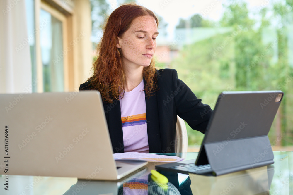 Smart businesswoman with devices at workspace Smart businesswoman with devices at workspace