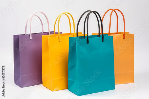 Colorful paper shopping bags isolated on white background. Shopping and retail concept. Generative AI