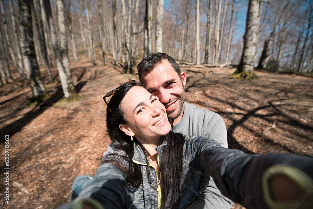 Smiling couple selfie during mountain trek Smiling couple selfie during mountain trek