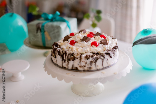 Ice cream cake with maraschino cherries photo