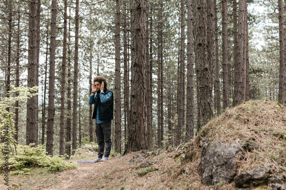 man standing in a forest man standing in a forest