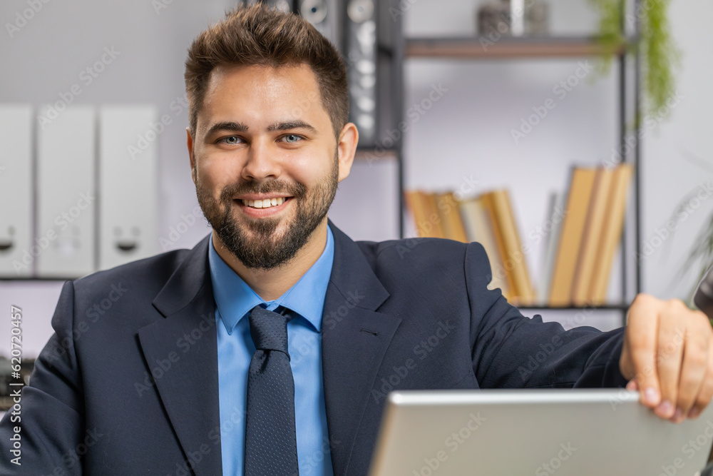 Caucasian bearded businessman freelancer at office workplace start working on laptop computer. Professional broker freelancer man opens notebook sends messages makes online purchases watching movies Caucasian bearded businessman freelancer at office workplace start working on laptop computer. Professional broker freelancer man opens notebook sends messages makes online purchases watching movies