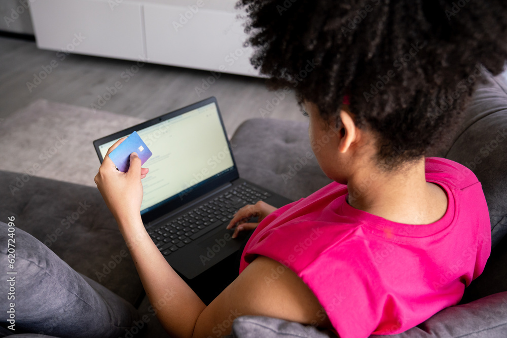 Woman Holding Credit Card And Using Computer Woman Holding Credit Card And Using Computer