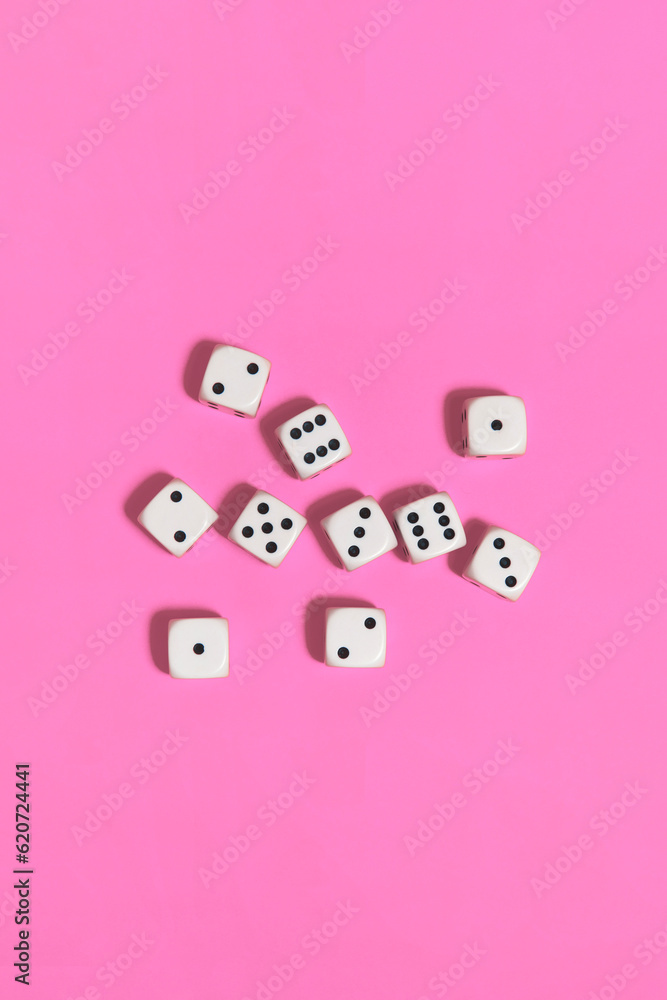 Dices on a pink background Dices on a pink background