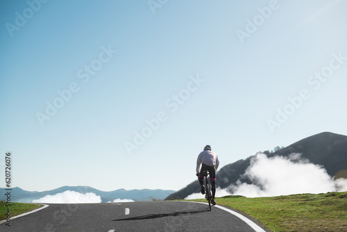 Cyclist riding on the top of the mountain