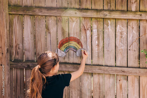 Rainbow chalk drawing on fence photo