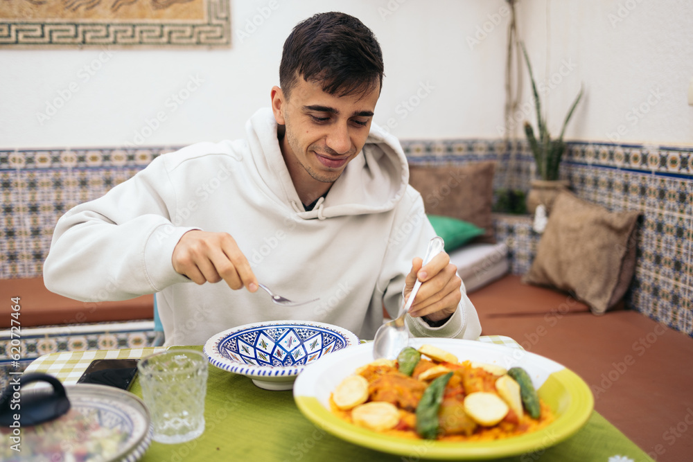 Young man eating Arabic food in Tunisia Young man eating Arabic food in Tunisia