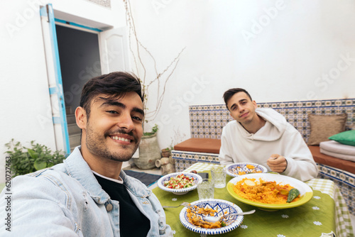 Selfie of friends eating Arabic food in Tunisia photo