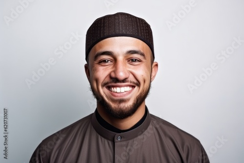 Portrait of a happy young man in a hat on a white background