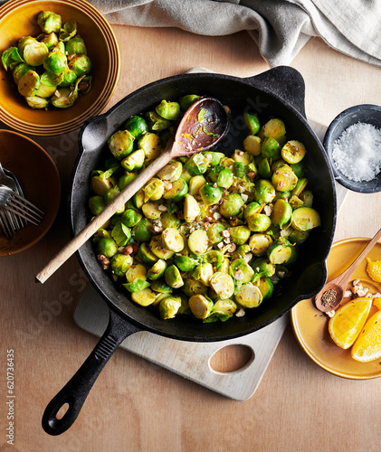 Skillet with sprouts and hazelnuts. photo