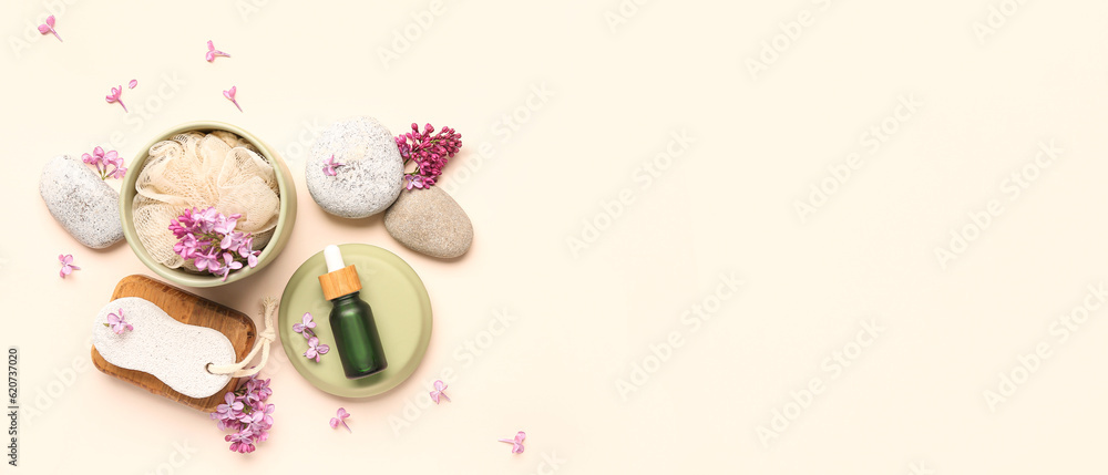 Bottle of serum with spa stones, pumice and bast wisp on light background with space for text