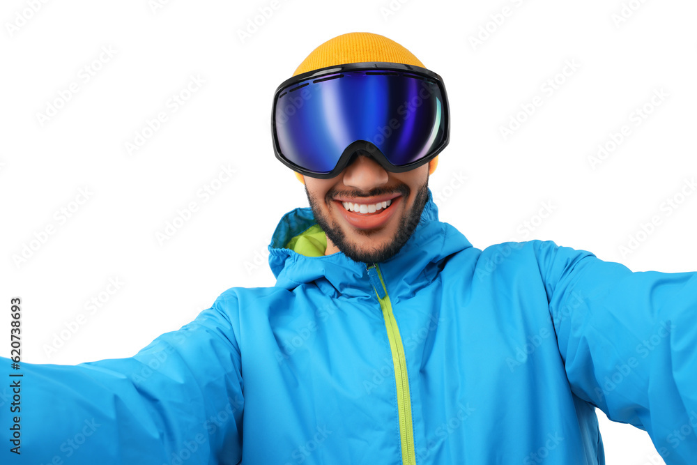 Smiling young man in ski goggles taking selfie on white background Smiling young man in ski goggles taking selfie on white background