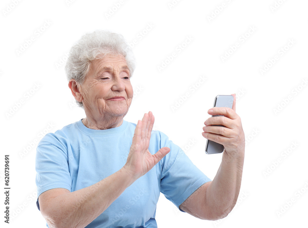 Senior woman with mobile phone taking selfie on white background Senior woman with mobile phone taking selfie on white background