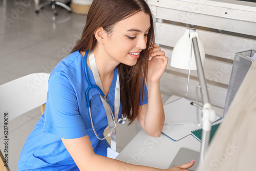 Female medical intern worki...