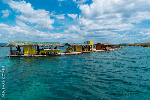 Floating houses on a turquoise Calatagan beach. Batangas, Philippines