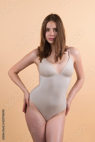 Sexy attractive woman posing with slim sexy body. Beautiful sexy model portrait. Beauty woman face. Attractive sensual girl.