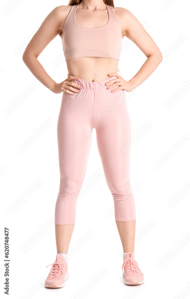 Young woman in sportswear on white background Young woman in sportswear on white background