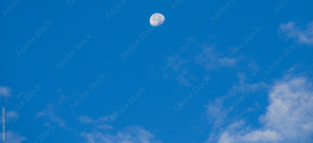The moon in the blue sky in the morning, natural background. The moon in the blue sky in the morning, natural background.