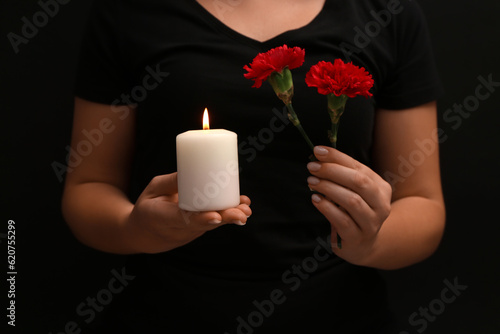 Woman holding burning candl...