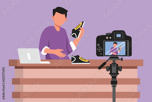 Graphic flat design drawing active young male blogger makes video review on camera on topic of sneakers. Online shopping, social media and influencer concept, symbol. Cartoon style vector illustration