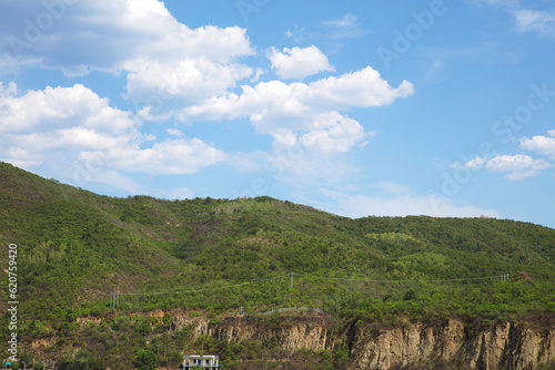 Mountains under the blue sky and white clouds