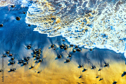 Rocky beach shoreline at Cemagi Beach, Bali, Indonesia