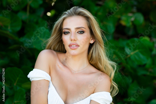 Fototapeta Naklejka Na Ścianę i Meble -  Tender romantic girl outdoor portrait. Beautiful young girl face. Young woman and spring nature. Fashion and beauty woman, makeup, cosmetics.