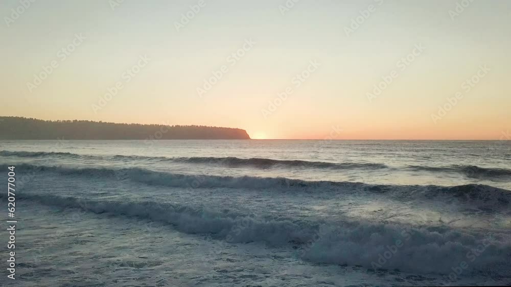 TRACKING WAVES ON BEACH PAN BACKWARDS DRONE SHOT - WEST COAST NEW ZEALAND TRACKING WAVES ON BEACH PAN BACKWARDS DRONE SHOT - WEST COAST NEW ZEALAND