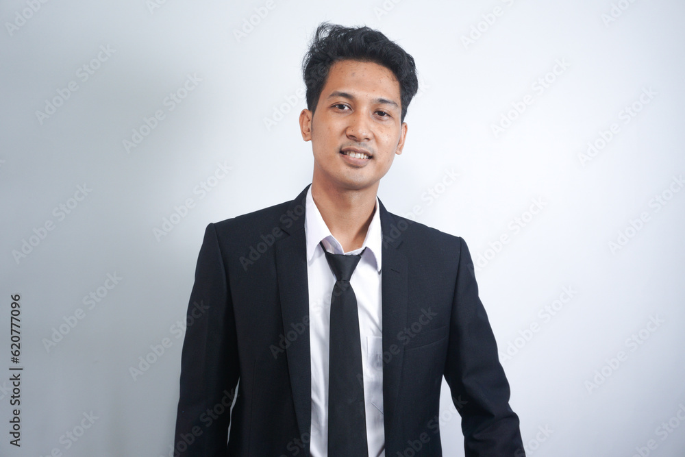 Portrait of handsome asian man in formal suit looking at camera smiling with toothy smile isolated in white background. Confident businessman ceo boss freelancer manager Portrait of handsome asian man in formal suit looking at camera smiling with toothy smile isolated in white background. Confident businessman ceo boss freelancer manager