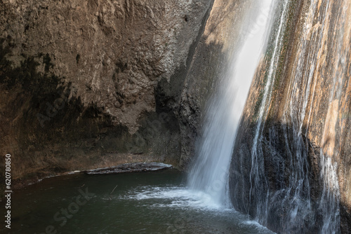 HaTanur waterfall flows from a crevice in the mountain and is located in the continuation of the rapid, shallow, cold mountain Ayun river, in the Galilee, near Metula city, in northern Israel