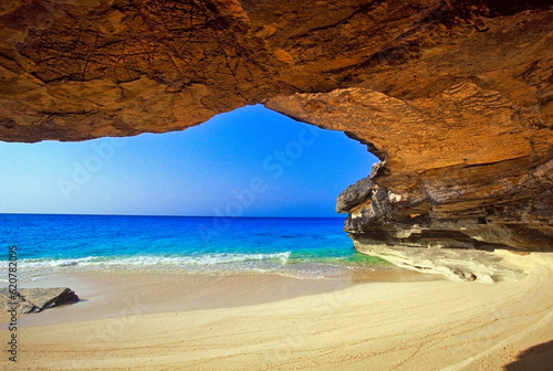 As sea cave formed by surf action on the small island of San Salvador in the Out Islands of The Bahamas
