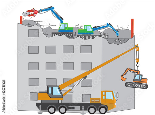 重機でビルの解体工事をしている。大型クレーン車でバックホウをビルに吊り上げている。