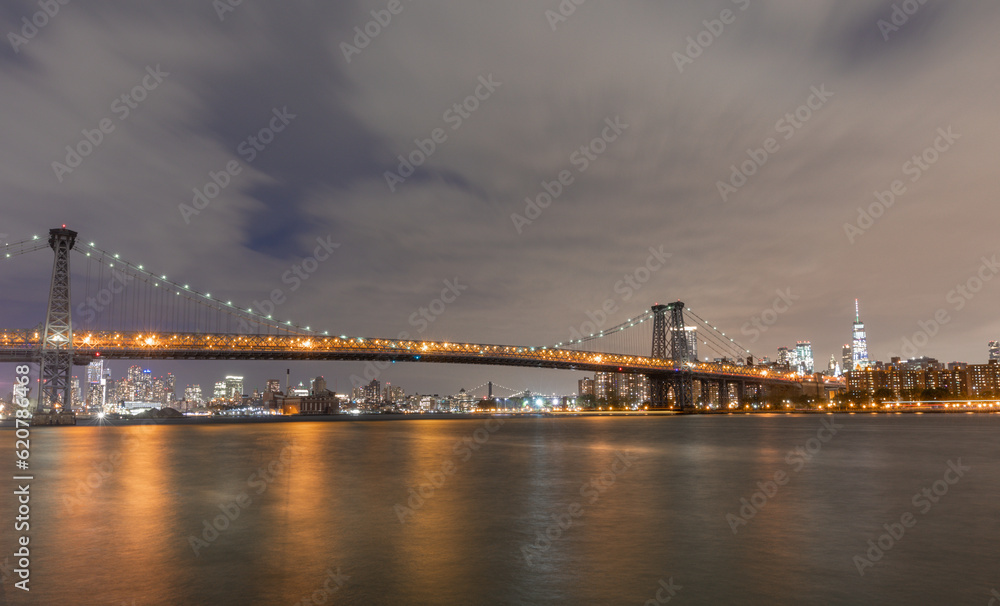 The Williamsburg Bridge is a suspension bridge in New York City across the East River connecting the Lower East Side of Manhattan at Delancey Street with the Williamsburg neighborhood of Brooklyn