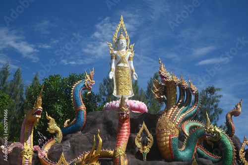 Group of beautiful statues of Buddha images, angels and Nagas at Wat Don Khanak Temple in order for religious people to travel to pay homage to the holy things. Located at Nakhon Pathom in Thailand. © topten22photo