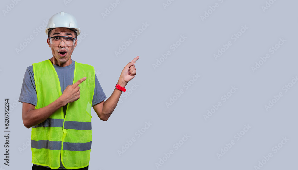 amazed engineer pointing to side isolated amazed engineer pointing to side isolated